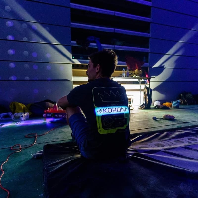 Climber resting on a mat during a late gym session